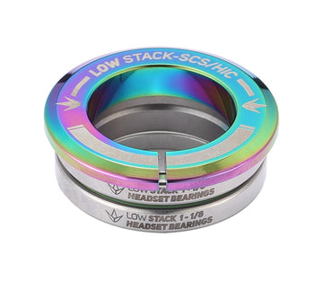 The Blunt Envy Low Stack SCS Integrated Stunt Scooter Headset in Oil Slick Neochrome features a rainbow-colored top piece with silver lower pieces. It is engraved with "LOW STACK - SCS/HIC" on the top and "LOW STACK 1-1/8 HEADSET BEARINGS" below, and includes fully sealed bearings for reliable performance.