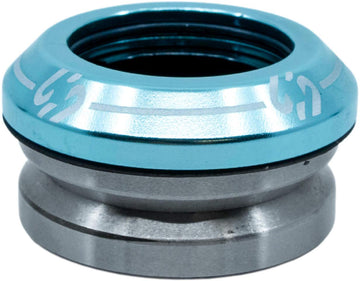 A close-up of the CORE Icon Integrated Stunt Scooter Headset - Blue by CORE, showing its blue anodized top cap and silver lower section—designed for smooth steering and compatibility with high-quality scooter bearings.