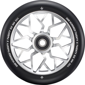A close-up of the Blunt Envy Sector 120mm Stunt Scooter Wheel - Silver features a black and silver design with geometric spokes. The edge is marked with “ONE HUNDRED TWENTY X TWENTY SIX MM 86A.”.
