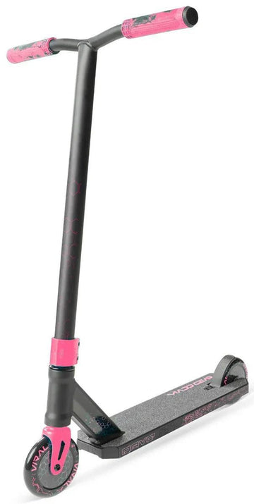 The Madd Gear (MGP) Viral Rave Complete Stunt Scooter - Melon features a black and pink design with a textured foot deck, two small wheels, and pink accents on the handlebars, fork, and wheels. It stands upright against a white background.