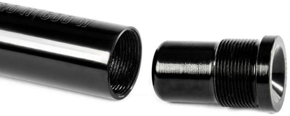 A close-up view of the Ethic DTC Handlebar Balance Point Modulation - 150g shows a black metal pipe with internal threads alongside a coordinating threaded cap, both precisely aligned for assembly—perfect as a scooter bar end to fine-tune balance points, crafted to Ethic’s renowned quality standards.