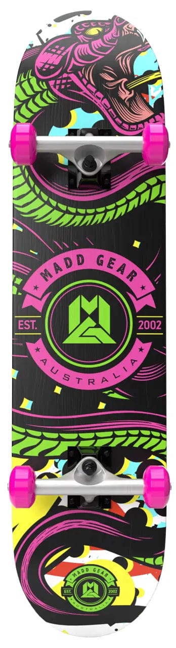 The Madd Gear MGP Pro Series KONDA LE Complete Skateboard (8" x 31") features pink wheels, a bold green and purple dragon graphic, and the Madd Gear PRO Australia logo with "EST. 2002." Part of the Complete Skateboards collection.