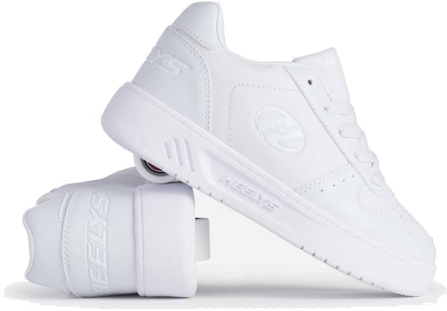 The Heelys Kama Girls Shoes in white are shown with one upright and one on its side, highlighting the low-profile heel wheels. These court-style Heelys shoes feature laces and the iconic Heelys logo.