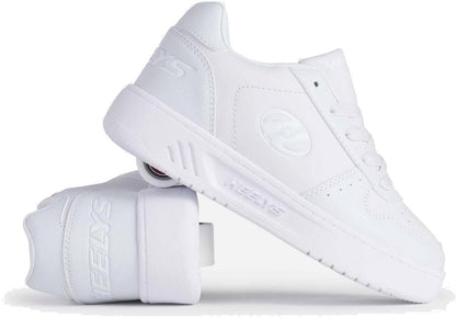 The Heelys Kama Girls Shoes in white are shown with one upright and one on its side, highlighting the low-profile heel wheels. These court-style Heelys shoes feature laces and the iconic Heelys logo.