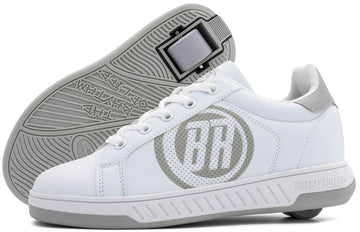 The Breezy Rollers Classic Shoes in White/Grey feature a retractable heel wheel, perforated circular logo on the side, and stylized sole patterns.