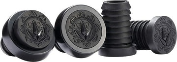 A collection of black, cylindrical Blunt Envy ends showcases decorative geometric patterns with a leaf motif on the top, drawing inspiration from Will Scott Signature artistry. In a group display, one is inverted to unveil its ribbed side, mirroring the precision seen in CNC Halo rings.