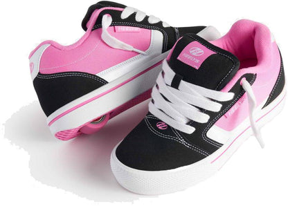 Heelys Pro 25 V2 Girls Shoes by Heelys in black, white, and pink, feature a visible heel wheel on one shoe and retro-inspired design with laces for classic '90s style.