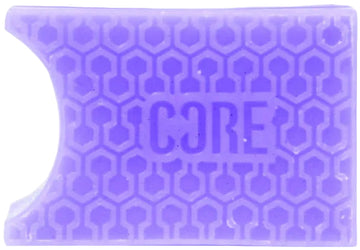 A rectangular blackcurrant purple grip with a honeycomb pattern and "CORE" embossed in the center, inspired by CORE Epic Skate Wax – Blackcurrant Purple, featuring a curved notch on the top left for skate wax fans.