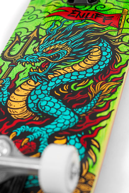 Close-up of the Enuff Yokai Dragon Complete Skateboard (8.25" x 32.1") by Enuff, showing its vibrant Japanese dragon artwork with red flames and a red flag logo, plus partially visible white wheels.