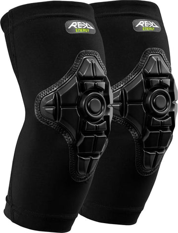 A pair of black REKD Energy Elbow Skate Protection Gaskets featuring a flexible, textured shell and REKD Energy Foam for advanced impact protection, with “REX Energy” branding on the upper part of each pad.
