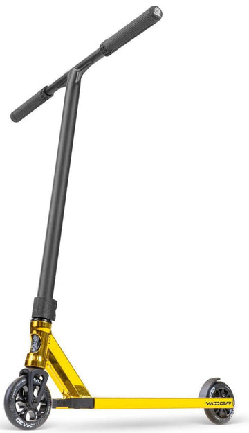 The Madd Gear MG 6 Kinetic Complete Stunt Scooter by MGP features a gold and black design, lightweight aluminium deck, T-shaped black handlebar, and small black wheels with ABEC-11 High-Speed Chrome bearings. Displayed on a white background.