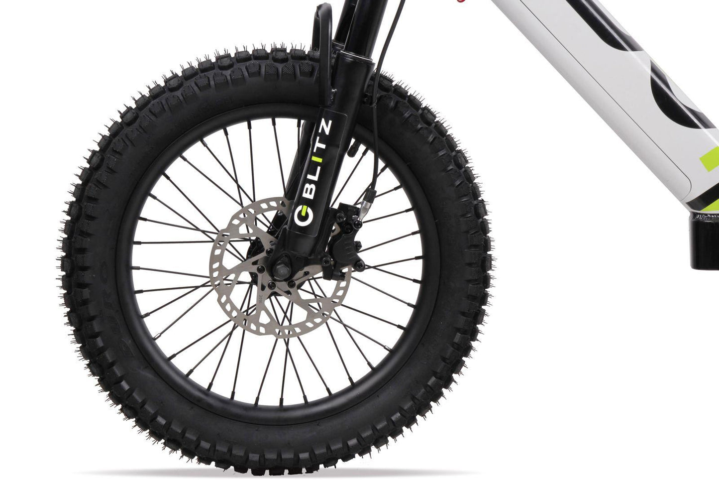 Close-up of a thick, knobby front tire with disc brake on the Duo 20" Blitz Kids Electric Balance Bike in white/black. The black fork shows "BLITZ" in white and green; the white frame has black and green accents.