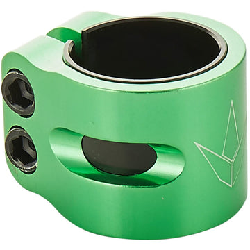 Close-up of the Blunt Envy Twin Slit 2 Bolt Oversized Scooter Clamp in green, showcasing a small cutout and an engraved geometric logo. This lightweight, cylindrical aluminum clamp with two hex screws is designed for securing components, possibly for stunt scooters or bicycles.
