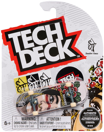 A Tech Deck 96mm M54 Fingerboard - Sandlot Times, in its packaging, displays bold “TECH DECK” branding, a cartoon face graphic with "Manny Santiago," authenticity labels, and safety warnings clearly on the front.