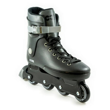 The CORE Retro Adjustable Inline Skates - Black feature a stylish black design with four wheels, a gray upper, and a silver buckle strap. Designed for both performance and comfort, the boot includes black laces and prominently showcases the "CORE" brand name on the side against a white backdrop.