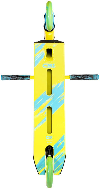 A top-down view of the CORE CB1 Beginner Complete Stunt Scooter by CORE in Highlighter Yellow and Blue, featuring blue stripes on the deck, blue-green wheels, and black and blue handlebars. The deck has two long slots and a cutout near the front, making it an ideal stunt scooter for beginners.
