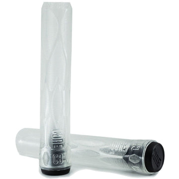 Two clear scooter grips are showcased, one standing and the other horizontal. Made by CORE from a shock-absorbing compound, they both have a textured wave-like design and are equipped with black end caps for superior impact protection—perfect for those who seek durability and high performance.