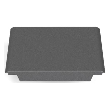 A rectangular, dark gray metal object with a flat top and curved edges, resembling the CORE Mini Funbox Ramp Set by CORE, is viewed from above against a white background.