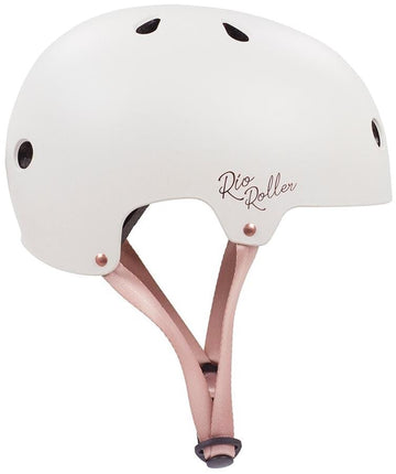The Rio Roller Rose Skate/Scooter Helmet in cream features a matte finish, the "Rio Roller" logo, ventilation holes, and an adjustable pink strap with a buckle—perfect for scooter enthusiasts seeking style and safety.