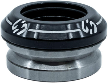 A close-up of the CORE Icon Integrated Stunt Scooter Headset in black, featuring durable bearings and white markings on the top cap, designed by CORE for smooth rotation in stunt scooter steering tube assemblies.