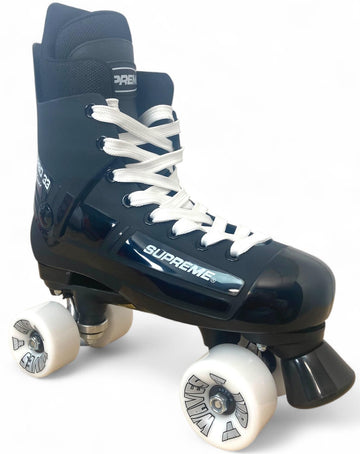 The Supreme Turbo 33 Nylon Quad Roller Skates feature a black and white design with white laces, white wheels, and "SUPREME" branding on the side—displayed on a white background.