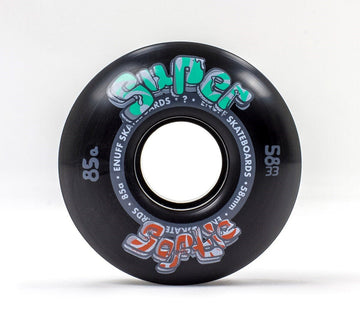 A black Enuff Super Softie 58mm 85A Skateboard Wheel features vivid graffiti-style text that reads "Super Soft 85a" and "Enuff Skateboards," set in a stylish font. The unique 85A compound of this wheel is perfectly highlighted against a plain white backdrop.