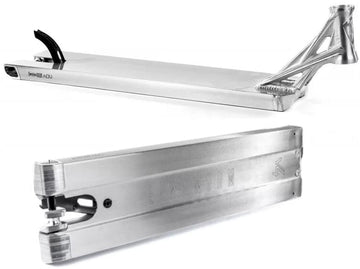 The sleek Ethic DTC Lindworm V4 Raw Silver Stunt Scooter Deck in a close-up highlights its lightweight design. This 5.9" x 21.25" deck boasts a brushed metal finish with intricate cutout details at the rear, while the Ethic brand name and logo are subtly embossed on the side.
