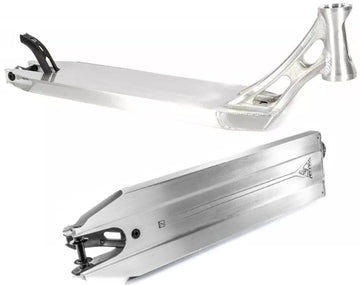 The Ethic DTC Vulcain V2 12 STD Raw Silver Stunt Scooter Deck from Ethic features a sleek silver finish with a minimalist aesthetic. It is designed with a flat top surface, open side cutouts to reduce weight, and a reinforced headtube. The deck offers versatile angles and includes the 12 STD bearing system, which can be observed from both side and top perspectives.