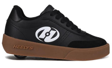 The Heelys Goleeh Boys Shoes in black/white/gum feature a black low-top court style with a brown sole, black laces, white logo, and a single wheel in the heel for rolling fun. Brand: Heelys.