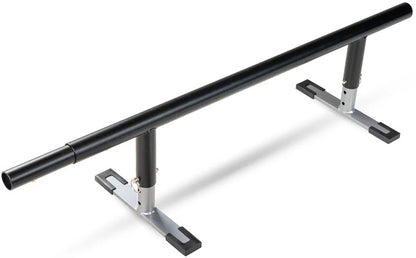 A black metal Madd Gear skate rail with adjustable height and sturdy silver-and-black base legs for skate or inline tricks. Compatible with the Madd Gear MGP Grind Rail Extension Kit - 91cm for added length and challenge.