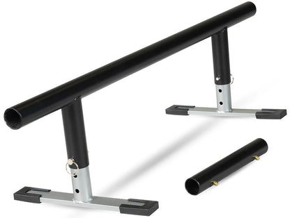A black metal grind rail with a cylindrical bar, supported by two vertical posts on flat bases. To the right is a detachable section compatible with the Madd Gear MGP Grind Rail Extension Kit - 91cm from Madd Gear (MGP).