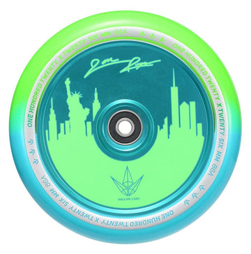 The Blunt Envy 120mm Jon Reyes Signature Hollow Core Stunt Scooter Wheel, designed in a dynamic green and teal color scheme, features an intricate city skyline that includes the Statue of Liberty. It showcases Jon Reyes' Signature with advanced Hollowcore Technology and has "One Hundred Twenty Six MM 86A" beautifully inscribed on the inner ring.