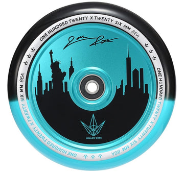 The Blunt Envy 120mm Jon Reyes Signature Hollow Core Stunt Scooter Wheel, in a striking black and teal color scheme, showcases a city skyline with the Statue of Liberty. The edge is inscribed with "One Hundred Twenty X Twenty Six MM 86A," blending style and precision performance seamlessly.