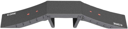 The CORE Mini Funbox Ramp Set - 2 Kickers & Flat Deck is a black plastic ramp by CORE, featuring two sloped sides, "CORE" in white on both ends, red dots, support legs under the platform, and a modular design.