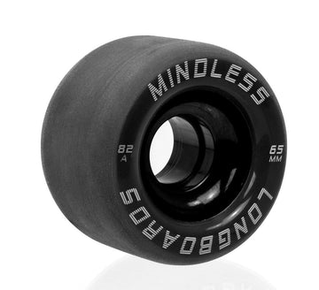 A close-up of a black wheel from the Mindless Viper 65mm 82A Longboard Wheels set, featuring "MINDBLOWERS" and "LONGBOARDS" printed in white. Perfect for downhill runs, this wheel stands upright on a reflective surface, offering outstanding grip and control.