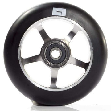 A close-up of the Logic 5 Spoke 100mm Stunt Scooter Wheel - Titanium showcases its black tire with a silver hub crafted from 6061-T6 Aluminium, featuring ABEC 9 bearings. A small stylized "L" logo adorns the side of the tire, all set against a white background.