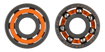 Two unshielded skateboard bearings are displayed side by side. The bearing on the left features an orange casing, while the one on the right reveals six silver balls encased in a black circular frame, incorporating Bronson's advanced audible speed technology for a superior riding experience.