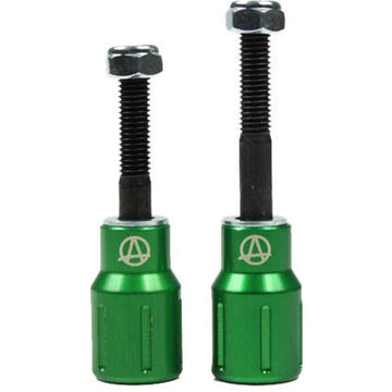 The Apex Barnaynay Aluminium Stunt Scooter Pegs in green are two sleek metal tools, each with a threaded black screw on top. One is taller than the other, both showcasing the Apex logo, which resembles a stylized "A," on their bodies. These robust pegs are ideal for enhancing your trick scooter's performance and style.
