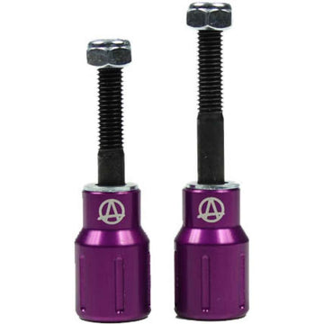 Two purple Apex Barnaynay aluminium stunt scooter pegs crafted with Kiall Barnes' design expertise, featuring a logo resembling an "A" and constructed from 7000 series aluminium with hex bolts on top.