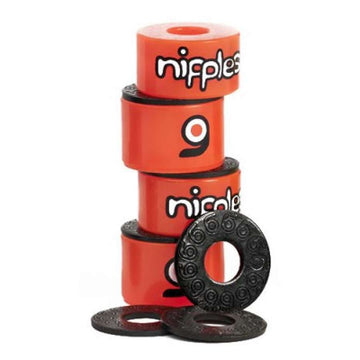 A stack of five orange skateboard bushings, labeled as Orangatang Nipples Orange Longboard Bushings - Soft 85A, highlights their high rebound urethane accompanied by four black washers with a circular pattern, making them perfect for carving and freestyle.