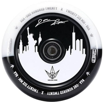 The Blunt Envy 120mm Jon Reyes Signature Hollow Core Stunt Scooter Wheel in black and white features a city skyline silhouette with the Statue of Liberty. In the center, it boasts a circular metallic component and Jon Reyes' signature, encircled by various model specifications on the rim, showcasing the expertise in hollow core wheel design.