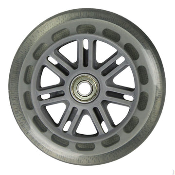 A close-up view of a single JD Bug Original Street 100mm Scooter Wheel in clear, featuring a metal bearing hub and a transparent outer rim. This wheel includes ABEC 5 bearings and is designed with angular spokes extending from the center to the edge.