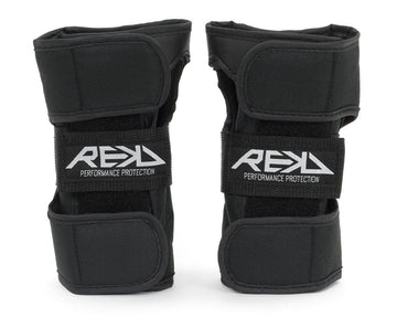 Two black REKD Skate Protection Wrist Guards, adorned with "REKD" on the front straps, are crafted for action sports. They include adjustable velcro straps for a secure fit and offer 360° protection, ensuring both comfort and safety.