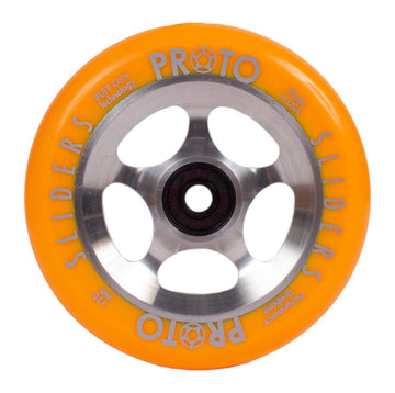 The product on display is the Proto Sliders Starbright 110mm Stunt Scooter Wheel in an orange/raw color scheme. It features a metal core with large circular cutouts and showcases white text highlighting its durable urethane technology. This wheel, manufactured by Proto, proudly sports a "Made in USA" label.