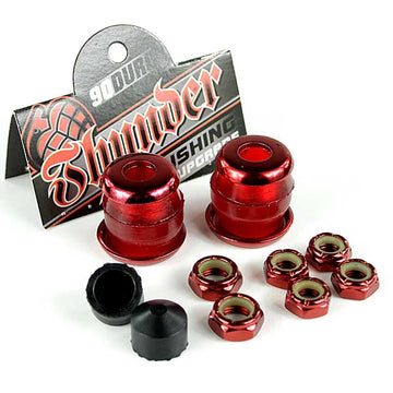 The Thunder Trucks Red Bushing Rebuild Kit - 90A is showcased with red urethane skateboard bushings that have a glossy finish. Included are eight matching nuts, along with two black caps. In the background, a packaging card displaying "Thunder" suggests it's a comprehensive rebuild kit.